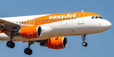 A flight from England to Spain's Canary Islands had to be diverted for police to meet disruptive passengers, easyJet said - insider.com - Spain - Britain