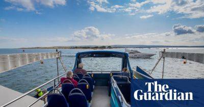 ‘The best thing about the No 50 is that it goes on a boat’: readers’ favourite UK bus journeys - theguardian.com - Japan - Britain - city Sandbank