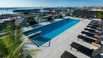 Montreal’s Newest Hotel Features Heated Rooftop Pool Open All Year - forbes.com - France - Britain - county St. Lawrence
