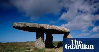 ‘It stands over us like a giant’s dining table’: on the trail of the UK’s ancient stones - theguardian.com - Britain