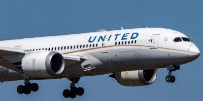 A United Airlines pilot has been charged after a video showed him taking an ax to a parking gate barrier at the Denver airport - insider.com - state Colorado - county Jones - county Henderson - county Adams