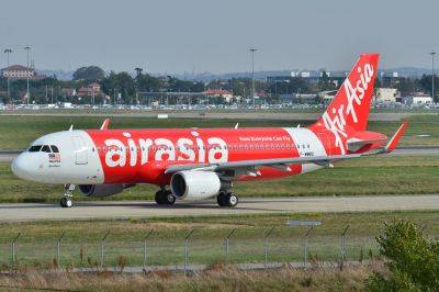 AirAsia Parent Narrowed Third Quarter Loss on Strong Travel Rebound - skift.com - Malaysia
