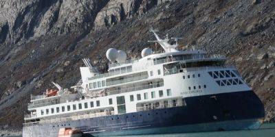 Rescuers in the Arctic tried and failed to free a 343-foot luxury cruise ship that's run aground, using a boat that's half its size - insider.com - Denmark - Greenland