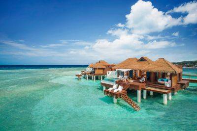 8 best overwater bungalows in the Caribbean - thepointsguy.com - Los Angeles - Aruba - Jamaica - county Bay - French Polynesia - city Sandal
