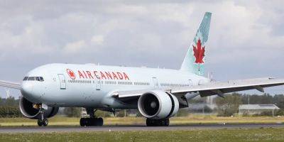 A passenger boarded a Boeing 777, then opened a door and fell out of the plane - insider.com - Canada - city Dubai