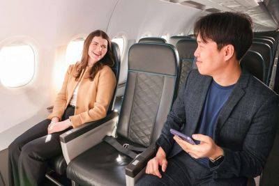 Frontier's New Seating Upgrade Guarantees an Empty Middle Seat and More Perks - travelandleisure.com - Britain