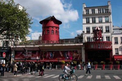 Moulin Rouge Keeps the ‘Parisian Party Alive’ After Iconic Windmill Falls Off - travelandleisure.com - France - city Paris - New York