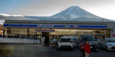 A Japanese town will erect a large mesh barrier to stop negligent foreign tourists from taking photos of Mount Fuji - insider.com - France - Japan