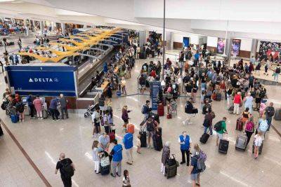 Delta Chaos Continues on Tuesday as Hundreds More Flights Canceled, Dept. of Transportation Opens Investigation - travelandleisure.com - city Atlanta - Jackson