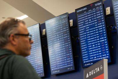 Delta to Reimburse Passengers Who Booked Another Airline Amid Mass Cancellations - travelandleisure.com - Usa